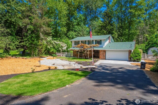 29701 52nd Ave E, Graham, WA 98338 - view of front of property featuring asphalt driveway, an attached garage, and brick siding