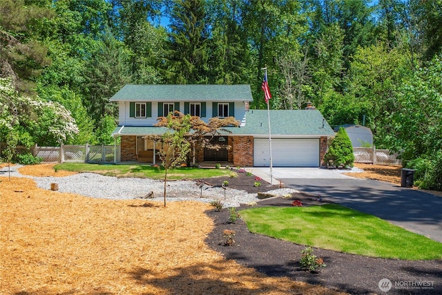 29701 52nd Ave E, Graham, WA 98338 - traditional home featuring asphalt driveway, a garage, a porch, and a chimney