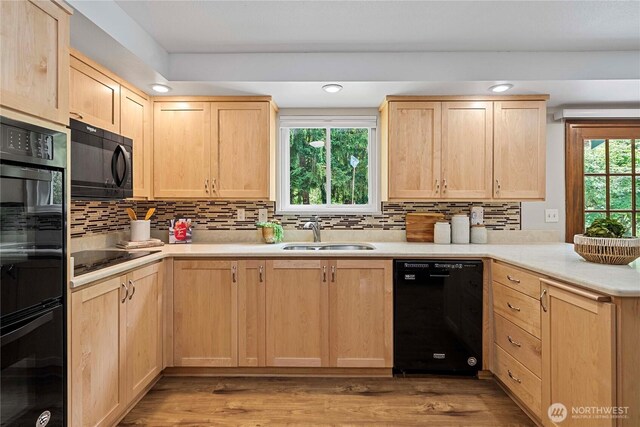 29701 52nd Ave E, Graham, WA 98338 - kitchen featuring light brown cabinetry, black appliances, a peninsula, decorative backsplash, and recessed lighting