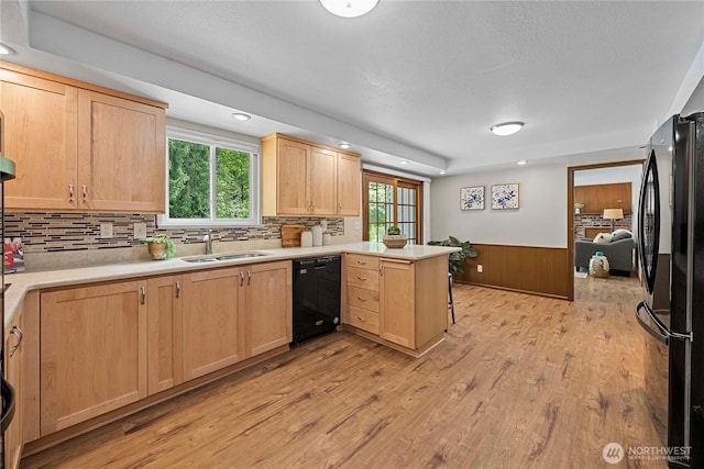 29701 52nd Ave E, Graham, WA 98338 - kitchen with black appliances, light brown cabinets, a peninsula, a wainscoted wall, and recessed lighting