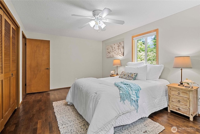 29701 52nd Ave E, Graham, WA 98338 - bedroom with wood finished floors, a ceiling fan, and a closet