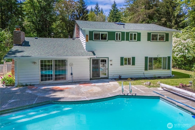29701 52nd Ave E, Graham, WA 98338 - rear view of property featuring a patio, an outdoor pool, a chimney, and roof with shingles