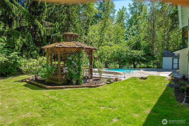 29701 52nd Ave E, Graham, WA 98338 - view of green lawn featuring a gazebo, a storage shed, an outdoor pool, and a patio