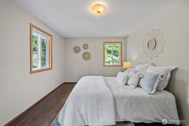29701 52nd Ave E, Graham, WA 98338 - bedroom with dark wood-type flooring and a textured ceiling
