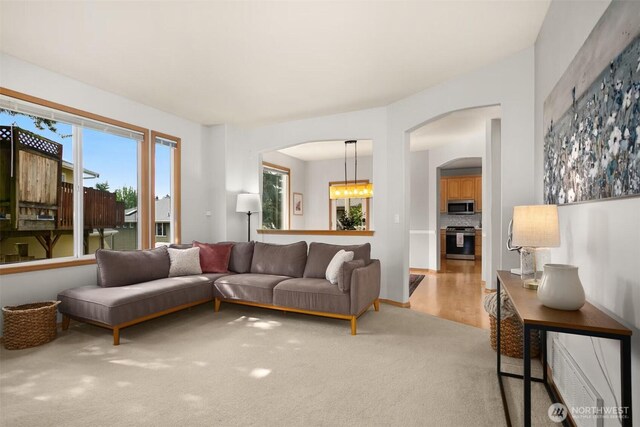 8233 NE 163rd Pl, Kenmore, WA 98028 - carpeted living area featuring arched walkways