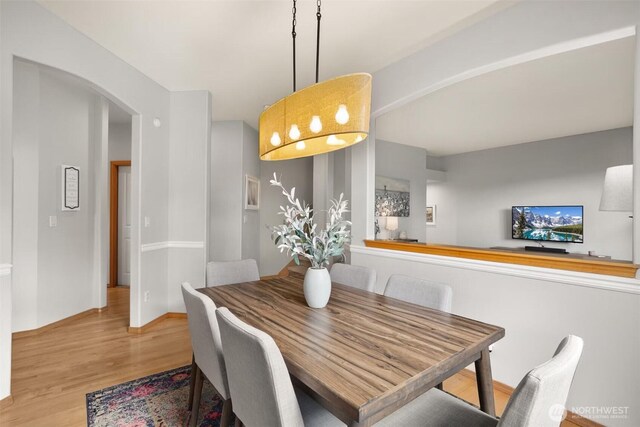 8233 NE 163rd Pl, Kenmore, WA 98028 - dining area with wood finished floors and arched walkways