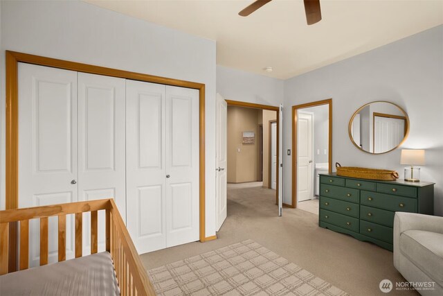 8233 NE 163rd Pl, Kenmore, WA 98028 - bedroom with light colored carpet, a closet, and a ceiling fan