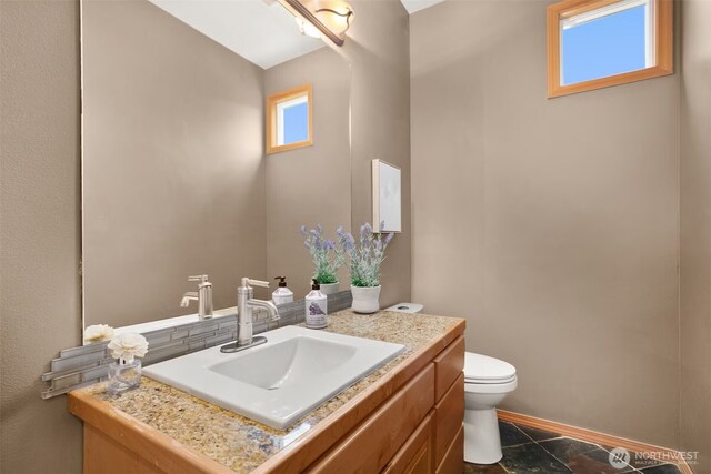 8233 NE 163rd Pl, Kenmore, WA 98028 - half bathroom featuring vanity and toilet