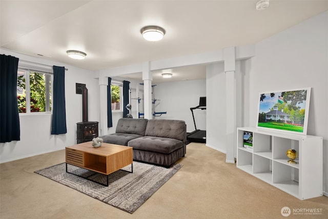 8233 NE 163rd Pl, Kenmore, WA 98028 - carpeted living room with a wood stove and healthy amount of natural light