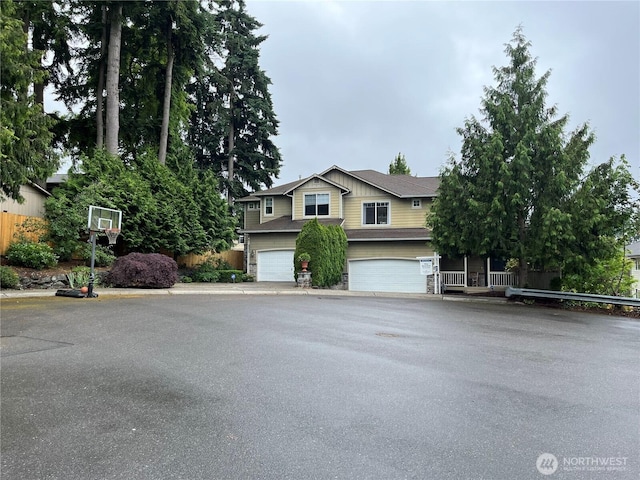 8233 NE 163rd Pl, Kenmore, WA 98028 - view of front facade featuring an attached garage and asphalt driveway