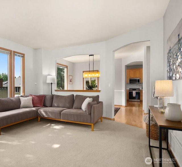 8233 NE 163rd Pl, Kenmore, WA 98028 - living room with arched walkways and light colored carpet