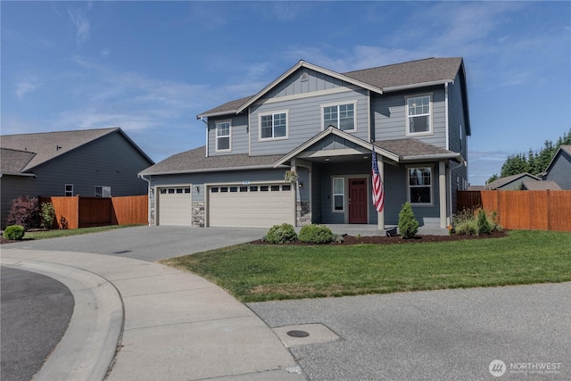 514 Wellington Pl, Sedro Woolley, WA 98284 - view of front of house with asphalt driveway, board and batten siding, an attached garage, a porch, and stone siding