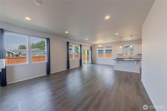 514 Wellington Pl, Sedro Woolley, WA 98284 - unfurnished living room featuring dark wood-style floors and recessed lighting