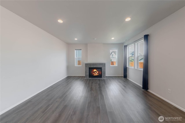 514 Wellington Pl, Sedro Woolley, WA 98284 - unfurnished living room featuring a tile fireplace, dark wood finished floors, and recessed lighting
