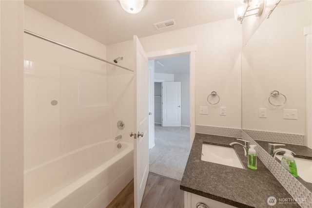 514 Wellington Pl, Sedro Woolley, WA 98284 - full bath with vanity, bathing tub / shower combination, and wood finished floors