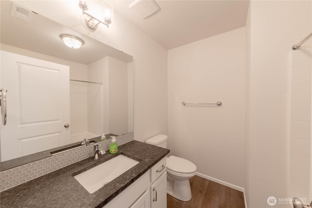 514 Wellington Pl, Sedro Woolley, WA 98284 - bathroom with wood finished floors, vanity, and a shower