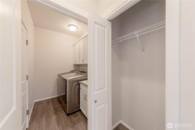 514 Wellington Pl, Sedro Woolley, WA 98284 - laundry area featuring cabinet space, separate washer and dryer, and light wood-style flooring