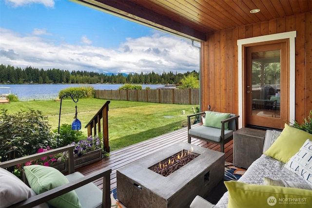 10904 W Lake Joy Dr NE, Carnation, WA 98014 - deck with a water view, an outdoor living space with a fire pit, and a forest view
