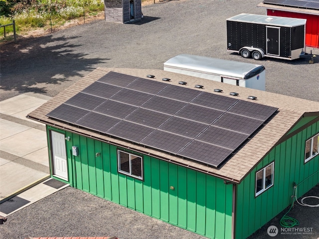 1241 Koontz Rd, Chehalis, WA 98532 - back of house with board and batten siding, a shingled roof, and solar panels