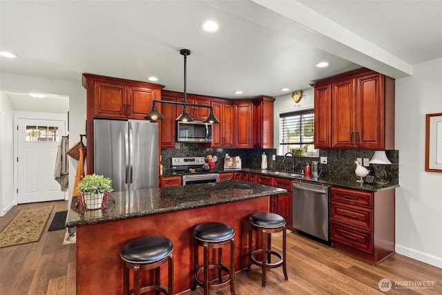 1241 Koontz Rd, Chehalis, WA 98532 - kitchen featuring stainless steel appliances, light wood finished floors, backsplash, pendant lighting, and recessed lighting
