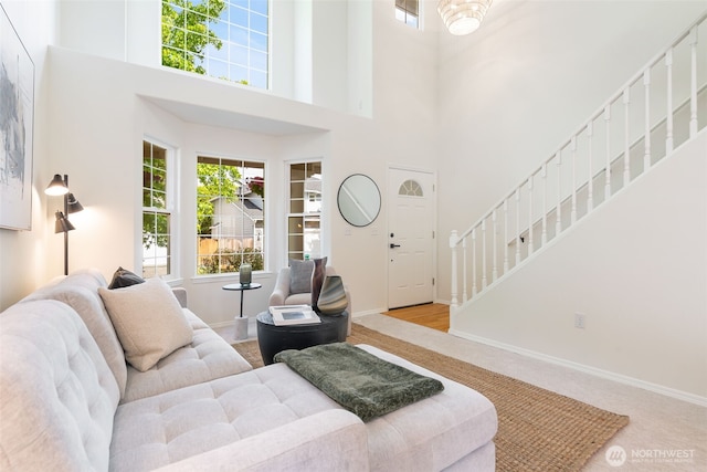 18022 29th Ave SE, Bothell, WA 98012 - living area with stairway, carpet flooring, healthy amount of natural light, and a towering ceiling