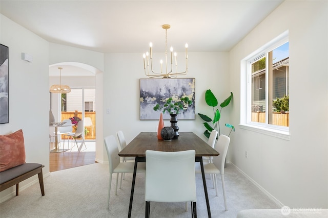 18022 29th Ave SE, Bothell, WA 98012 - dining room with a chandelier, light carpet, and arched walkways