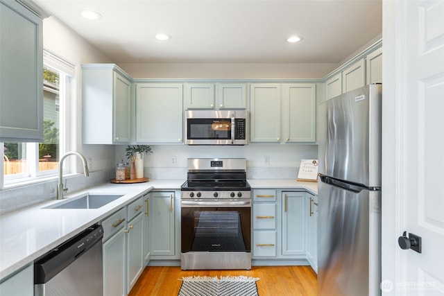 18022 29th Ave SE, Bothell, WA 98012 - kitchen with stainless steel appliances, light countertops, light wood-style floors, and recessed lighting