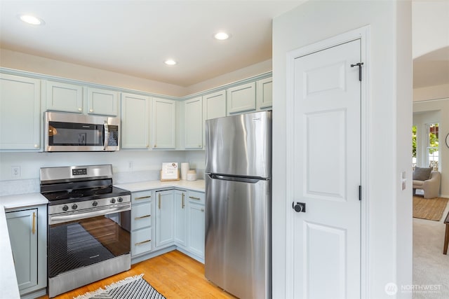 18022 29th Ave SE, Bothell, WA 98012 - kitchen featuring stainless steel appliances, light countertops, recessed lighting, and light wood-style flooring