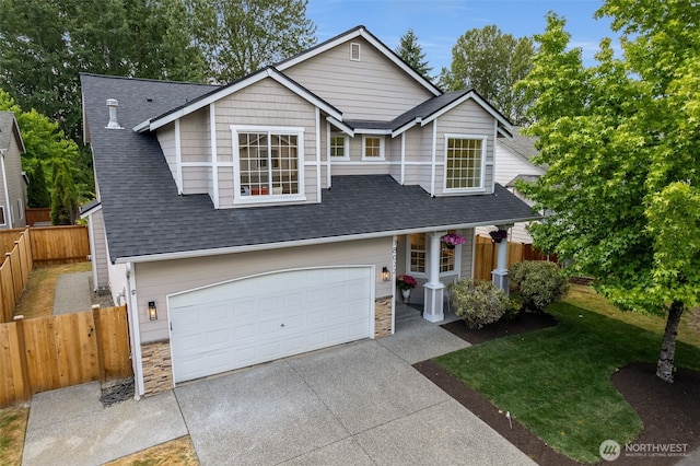 18022 29th Ave SE, Bothell, WA 98012 - view of front facade with concrete driveway, roof with shingles, an attached garage, and stone siding