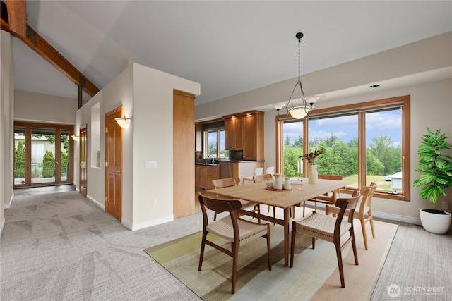 1409 Marietta Ave, Bellingham, WA 98226 - dining area featuring light carpet, plenty of natural light, and a chandelier