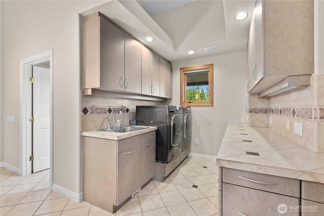 1409 Marietta Ave, Bellingham, WA 98226 - laundry room featuring washer and dryer, light tile patterned floors, cabinet space, and recessed lighting