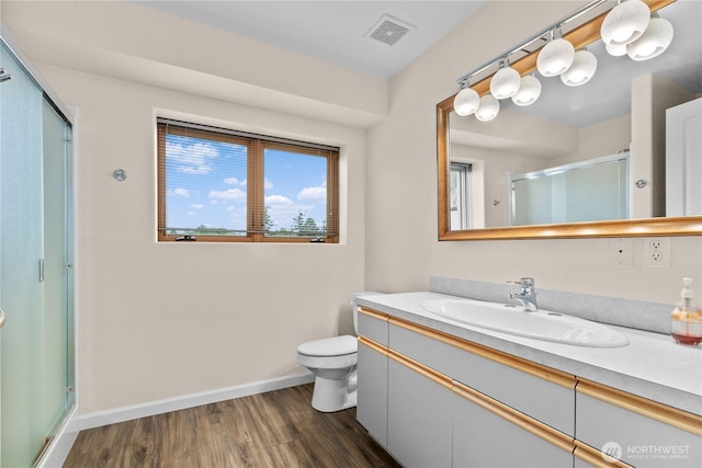 1409 Marietta Ave, Bellingham, WA 98226 - bathroom featuring a shower stall, vanity, and wood finished floors