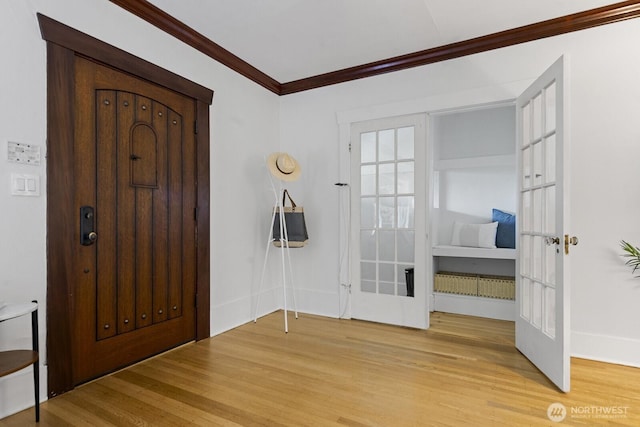 4628 Sunnyside Ave N, Seattle, WA 98103 - foyer featuring light wood finished floors, ornamental molding, and french doors