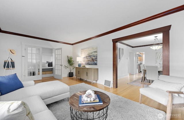 4628 Sunnyside Ave N, Seattle, WA 98103 - living area with ornamental molding and wood finished floors