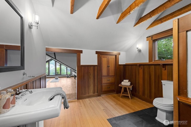 4628 Sunnyside Ave N, Seattle, WA 98103 - bathroom with healthy amount of natural light, a wainscoted wall, wood-type flooring, and wood walls