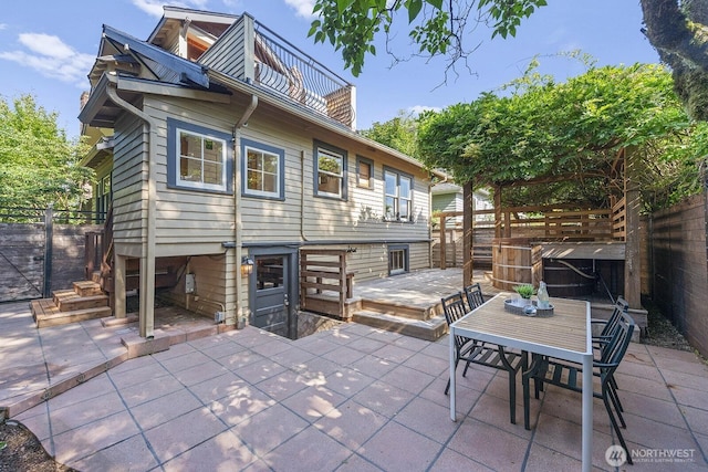 4628 Sunnyside Ave N, Seattle, WA 98103 - rear view of house with a fenced backyard, outdoor dining area, and a patio