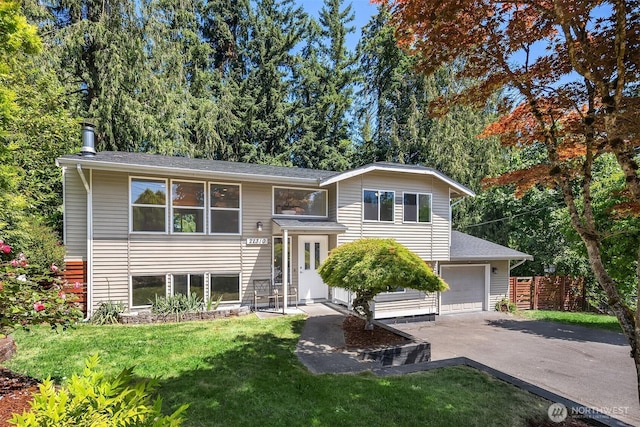 21310 SE 412th Pl, Enumclaw, WA 98022 - bi-level home with asphalt driveway and a garage