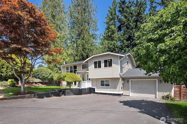 21310 SE 412th Pl, Enumclaw, WA 98022 - split level home featuring asphalt driveway and an attached garage