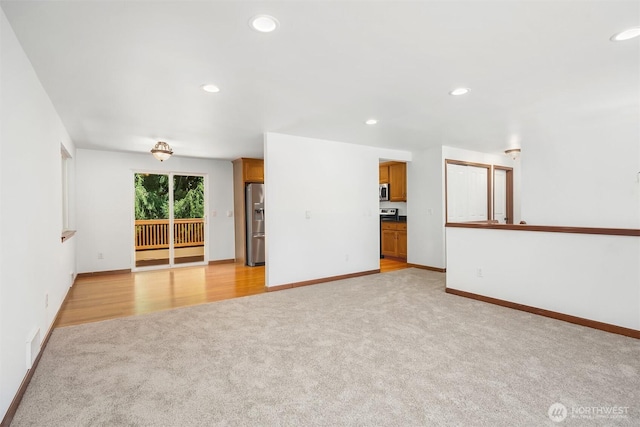 21310 SE 412th Pl, Enumclaw, WA 98022 - spare room with light colored carpet and recessed lighting