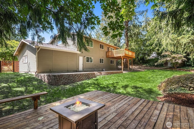 21310 SE 412th Pl, Enumclaw, WA 98022 - wooden deck featuring an outdoor fire pit, a lawn, and a patio area