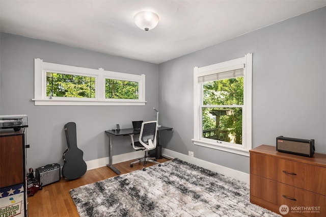103 NW 62nd St, Seattle, WA 98107 - office area featuring healthy amount of natural light and wood finished floors