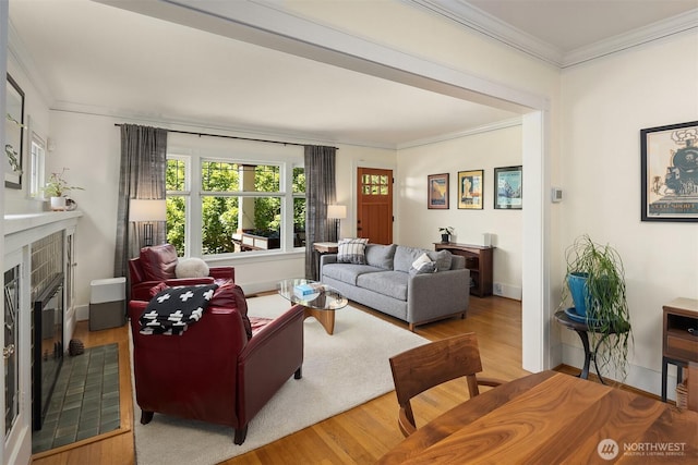 103 NW 62nd St, Seattle, WA 98107 - living room with a tiled fireplace, wood finished floors, and ornamental molding