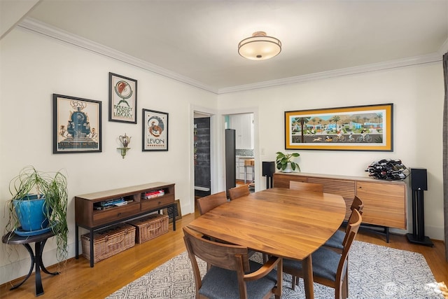 103 NW 62nd St, Seattle, WA 98107 - dining space featuring crown molding and wood finished floors