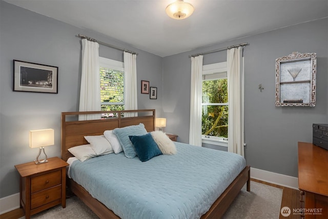 103 NW 62nd St, Seattle, WA 98107 - bedroom with multiple windows and wood finished floors