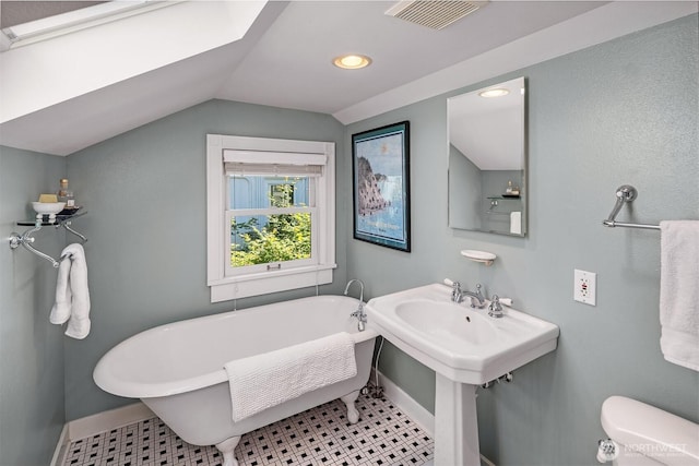103 NW 62nd St, Seattle, WA 98107 - bathroom with vaulted ceiling, a freestanding tub, and recessed lighting