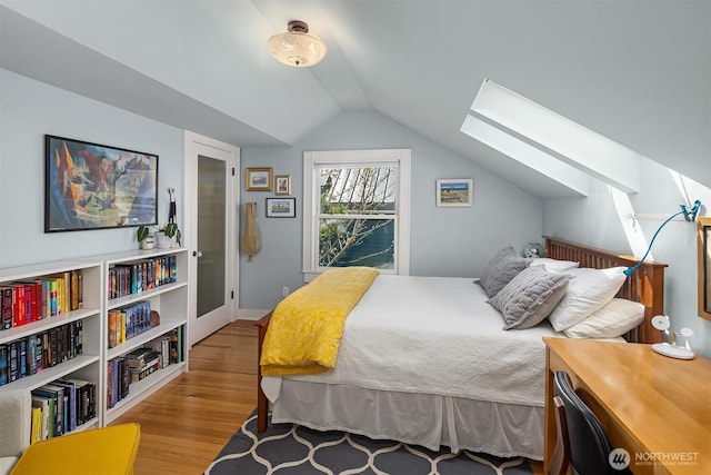103 NW 62nd St, Seattle, WA 98107 - bedroom featuring a skylight, wood finished floors, and vaulted ceiling