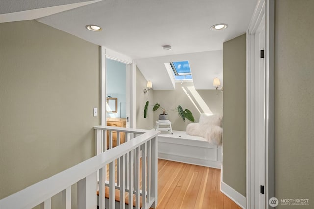 103 NW 62nd St, Seattle, WA 98107 - hall with a skylight, wood finished floors, recessed lighting, an upstairs landing, and lofted ceiling