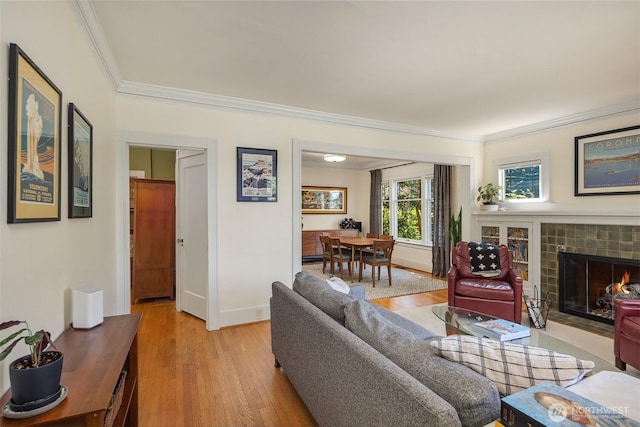 103 NW 62nd St, Seattle, WA 98107 - living area featuring ornamental molding, light wood-type flooring, and a tile fireplace