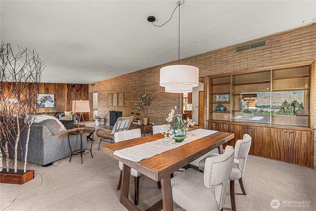 1840 Country Club Dr, East Wenatchee, WA 98802 - dining area with light colored carpet, brick wall, and wood walls