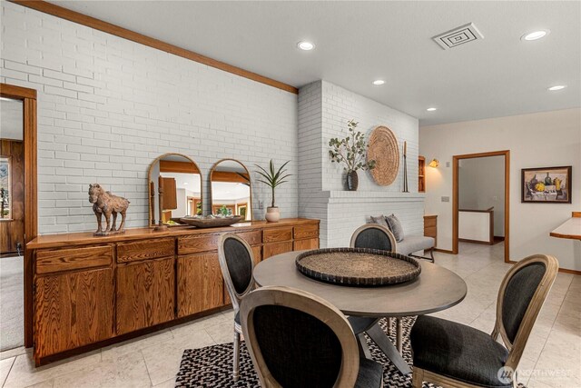 1840 Country Club Dr, East Wenatchee, WA 98802 - dining area with recessed lighting, light tile patterned flooring, and brick wall